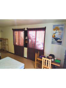 Una cama o camas en una habitación de Casa NAU Mazunte