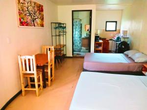 Una cama o camas en una habitación de Casa NAU Mazunte