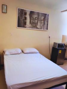 Una cama o camas en una habitación de Casa NAU Mazunte