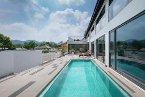 a swimming pool on the roof of a house at Jun hade on hillside in Hangzhou