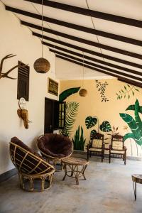 a living room with chairs and a couch at Kottamba Yala Stay & Safari in Tissamaharama