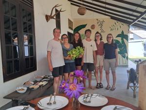 a group of people posing for a picture in a room at Kottamba Yala Stay & Safari in Tissamaharama