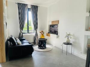 Posezení v ubytování Maison "Au fil de l'eau"