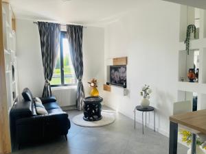 Posezení v ubytování Maison "Au fil de l'eau"
