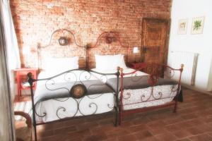 En eller flere senge i et værelse på Il Poggio B&B