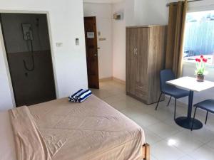 Postel nebo postele na pokoji v ubytování K2 Seaside Suites