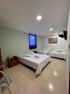 Postel nebo postele na pokoji v ubytování Hotel Estambul