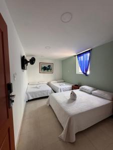 Postel nebo postele na pokoji v ubytování Hotel Estambul
