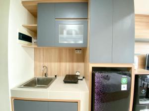 Kuchyň nebo kuchyňský kout v ubytování Minimalist Studio at Pollux Chadstone Apartment By Travelio