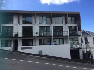 a building on the side of a street at Luxurious new apartment in the heart of the city in Dunedin