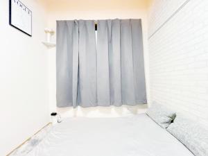 A bed or beds in a room at 西早稲田駅&高田馬場駅最大4人