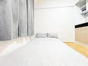 A bed or beds in a room at 西早稲田駅&高田馬場駅最大4人