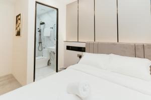 Postel nebo postele na pokoji v ubytování Brilliant Hotel Dan Spa