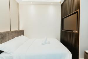 Postel nebo postele na pokoji v ubytování Brilliant Hotel Dan Spa