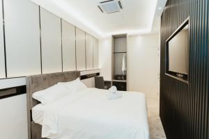 Postel nebo postele na pokoji v ubytování Brilliant Hotel Dan Spa