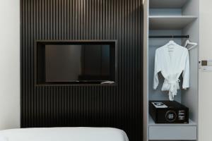 Postel nebo postele na pokoji v ubytování Brilliant Hotel Dan Spa