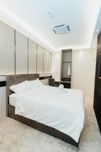 Postel nebo postele na pokoji v ubytování Brilliant Hotel Dan Spa