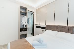 Postel nebo postele na pokoji v ubytování Brilliant Hotel Dan Spa
