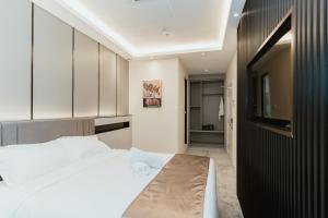 Postel nebo postele na pokoji v ubytování Brilliant Hotel Dan Spa