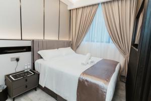 Postel nebo postele na pokoji v ubytování Brilliant Hotel Dan Spa