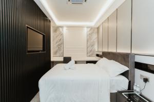 Postel nebo postele na pokoji v ubytování Brilliant Hotel Dan Spa