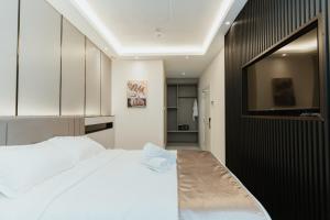 Postel nebo postele na pokoji v ubytování Brilliant Hotel Dan Spa