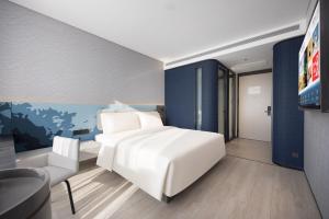Cama o camas de una habitación en Atour Light Hotel Shenyang Yuhong Plaza Metro Station