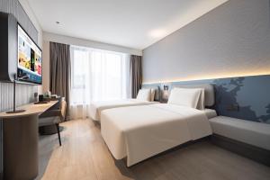 Cama o camas de una habitación en Atour Light Hotel Shenyang Yuhong Plaza Metro Station