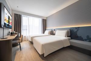Cama o camas de una habitación en Atour Light Hotel Shenyang Yuhong Plaza Metro Station