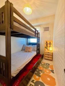 a bedroom with a bunk bed in a room at Happy Nest at La Bella Condo Banilad Mandaue Cebu 2 Bedrm Free wifi 6pax max in Banilad