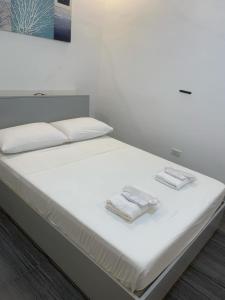 Postel nebo postele na pokoji v ubytování MAMORI HOTEL