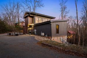 a house with a large window on the side of it at Sugar Plum Pines in Gatlinburg