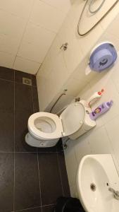 a bathroom with a toilet and a sink at Vista Alam P Small Studio in Shah Alam
