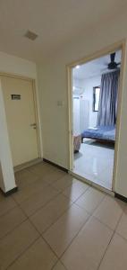 a living room with a mirror and a bed at Vista Alam P Small Studio in Shah Alam +36 photos