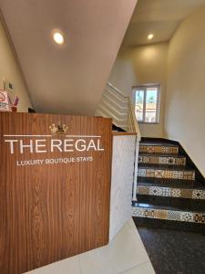 a store with a sign that reads the retail luxury boutique stays at The Regal Luxury Boutique Stays in Majorda