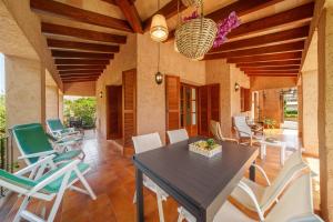 a dining room with a table and chairs at E415 Can Xisco by Mallorca Villa Selection in Port de Pollensa
