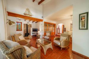 a living room with chairs and a table at E415 Can Xisco by Mallorca Villa Selection in Port de Pollensa