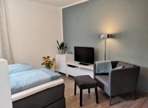 TV a/nebo společenská místnost v ubytování Ferienwohnung Morgenlicht