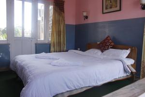 Katil atau katil-katil dalam bilik di Hotel Fishtail Villa