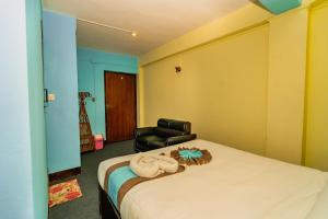 Ein Bett oder Betten in einem Zimmer der Unterkunft Rest Up Thamel Hostel