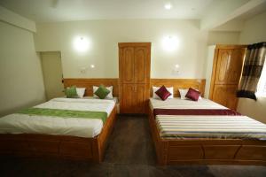 Postel nebo postele na pokoji v ubytování Naksha Tree Hotels - Yelagiri
