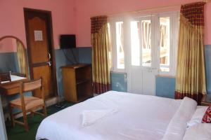 Katil atau katil-katil dalam bilik di Hotel Fishtail Villa