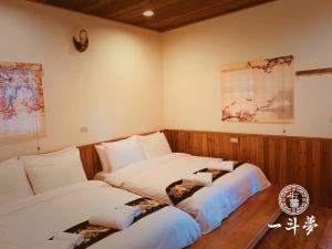 Voodi või voodid majutusasutuse 日月潭一斗夢Yidou Meng Yi Zhan toas