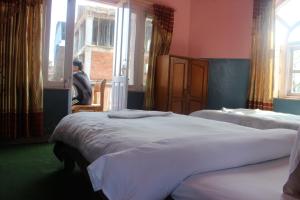 Katil atau katil-katil dalam bilik di Hotel Fishtail Villa