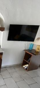 a flat screen tv hanging on a wall at La Meridiana Antica Residenza in Mesagne