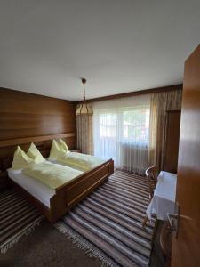 Postel nebo postele na pokoji v ubytování Haus Talblick