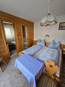 Postel nebo postele na pokoji v ubytování Haus Talblick