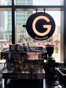 a coffee machine sitting in front of a window at GLAD Gangnam COEX Center in Seoul