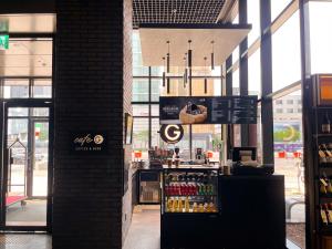 a grocery store with a counter with drinks in it at GLAD Gangnam COEX Center in Seoul