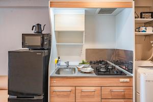 Kuchyň nebo kuchyňský kout v ubytování Apartment Hotel 11 Namba Minami 3